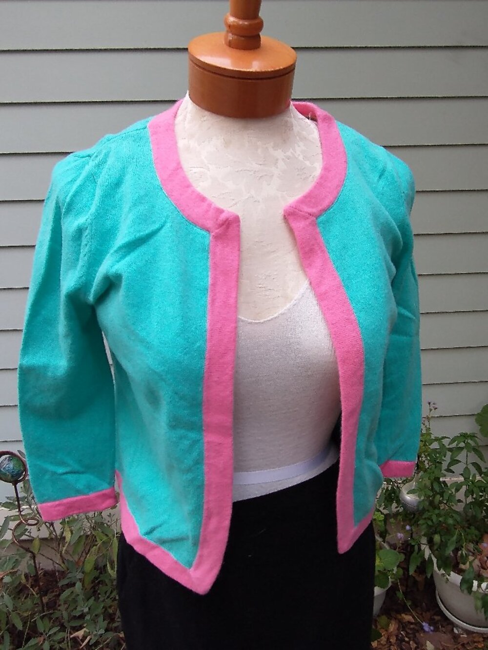Cardigan: cashmere, aqua w/pink trim, buttonless. Size medium - by Dana Buchman